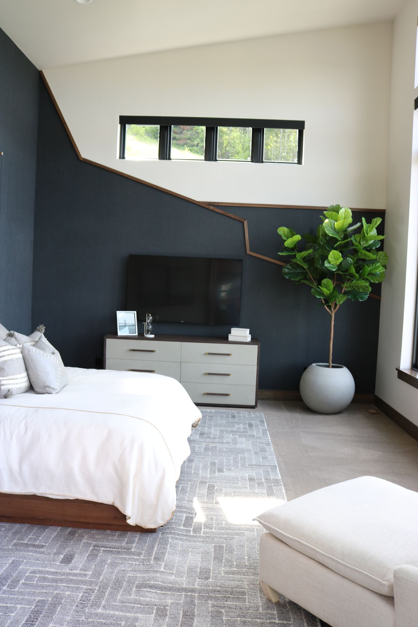 Bedroom with a dark accent wall, Millview Renovation