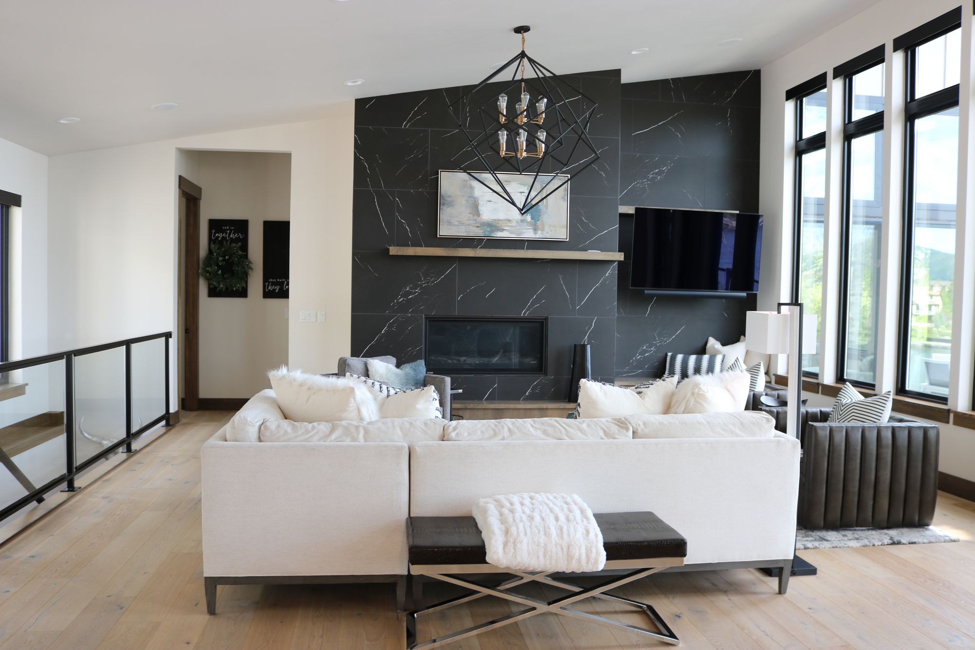 Living room with a dark feature wall, Millview Renovation