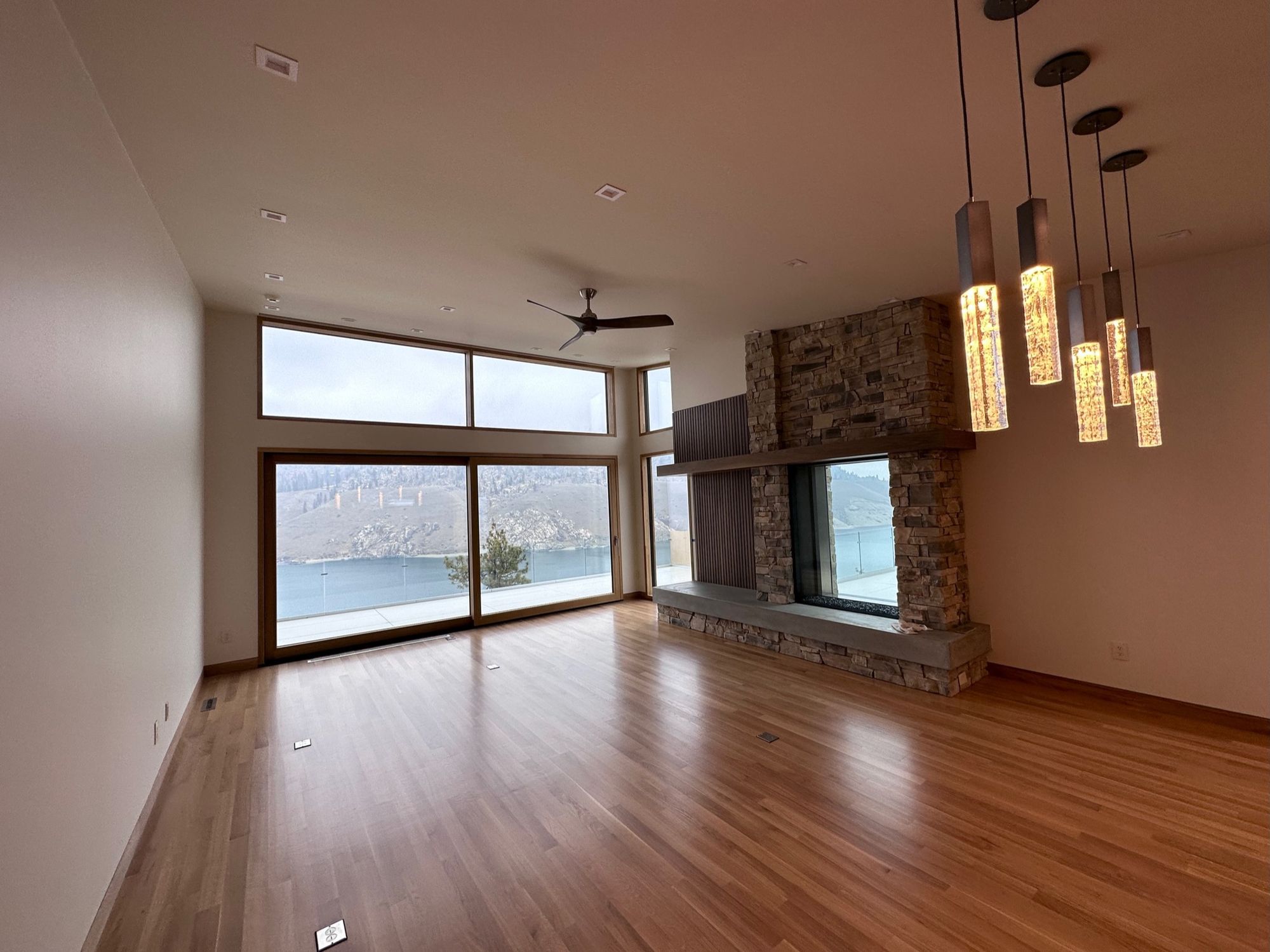 Great room with a stone fireplace and glass, Roosevelt