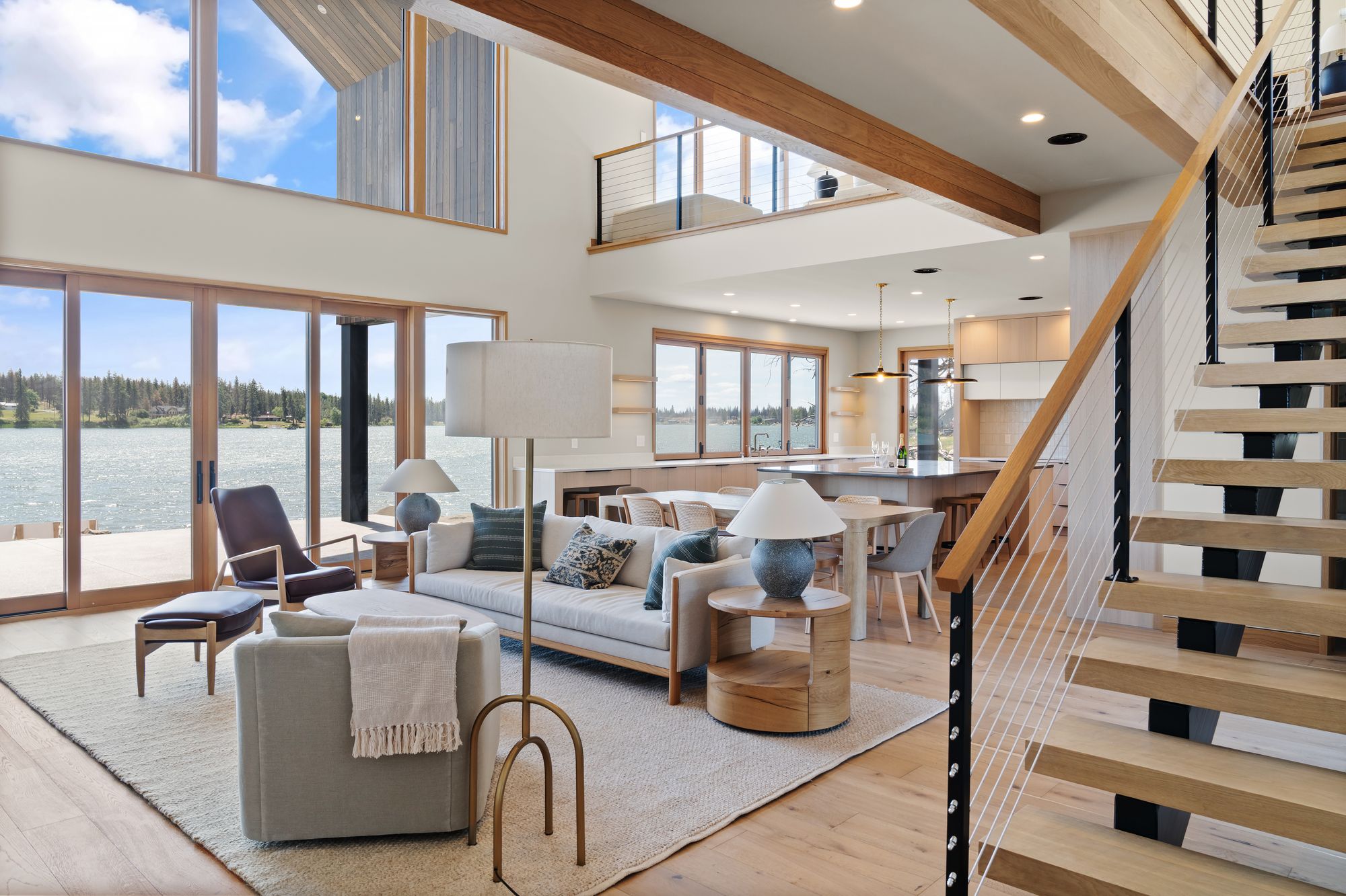 Great room with a floating stair and lake views, Silver Lake